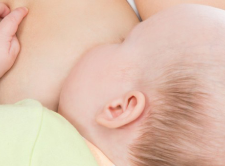 A baby is breastfed
